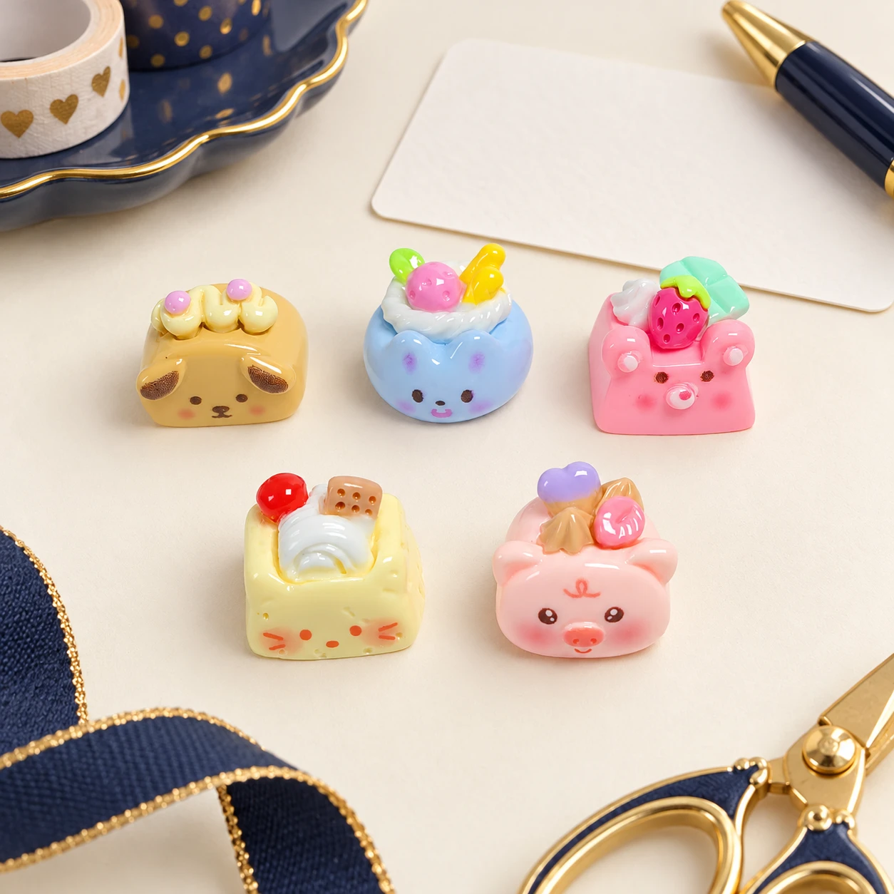 Animal Face Cake Resin Charms RW001867 in an illustrative craft workspace