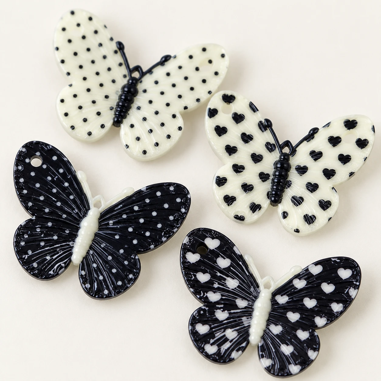 Black and White Spotted Butterfly Resin Charms RW002637 close-up showing the decorative shape and finish