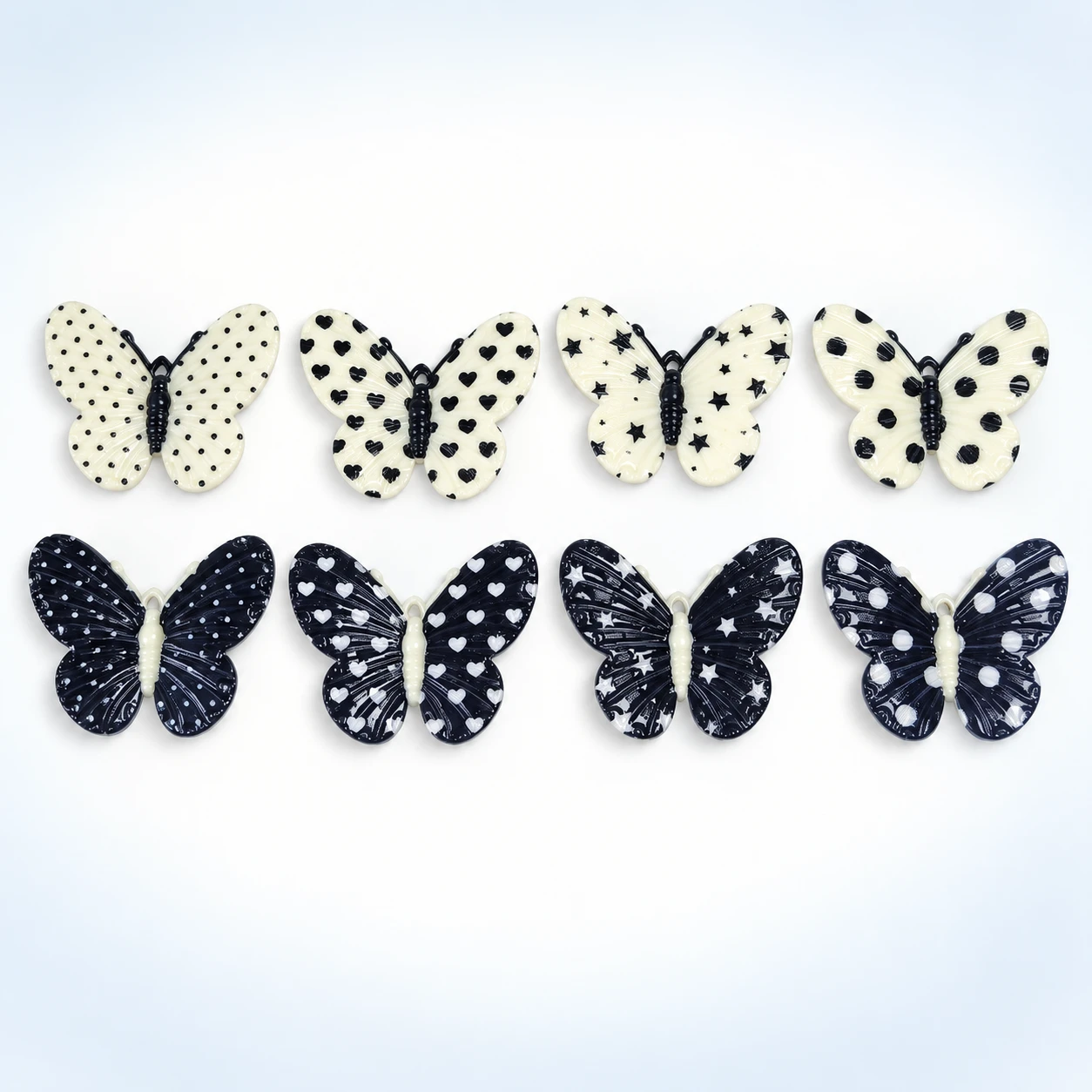 Black and White Spotted Butterfly Resin Charms RW002637 on a clean light studio background