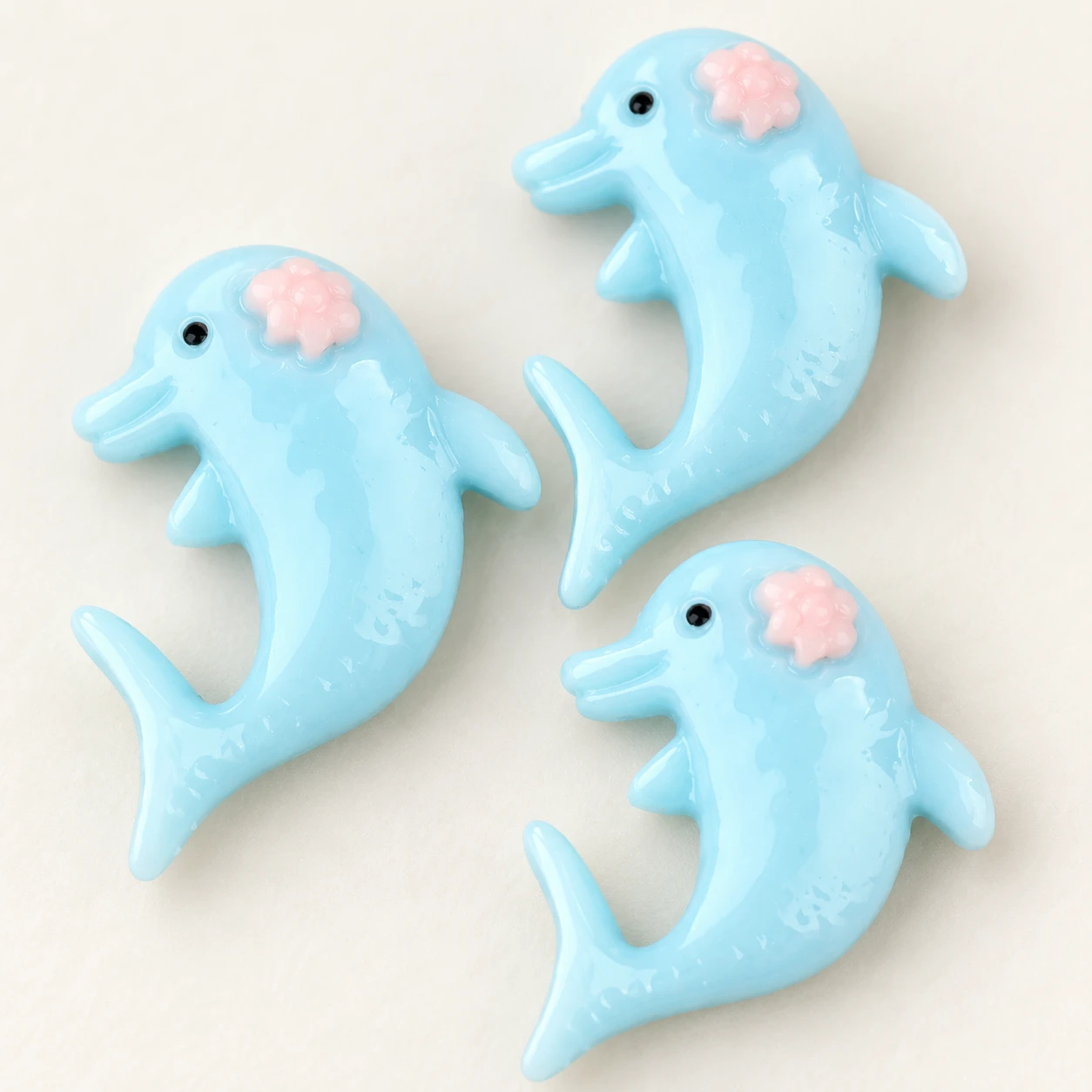 Blue Dolphin Resin Charm RW001078 close-up showing the decorative shape and finish