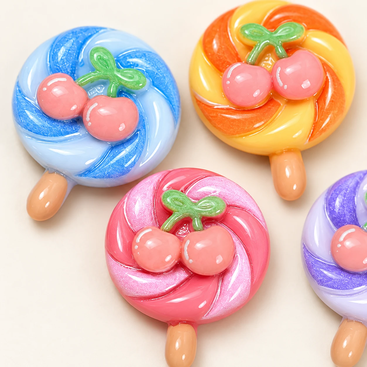 Cherry Swirl Lollipop Resin Charms RW003313 close-up showing the decorative shape and finish