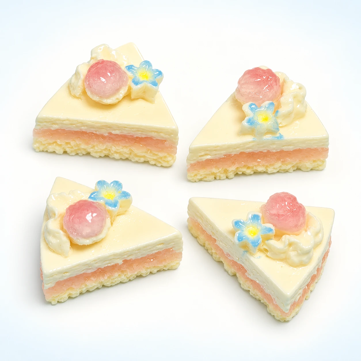 Fruit-Topped Triangle Cake Resin Charms RW002079 on a clean light studio background