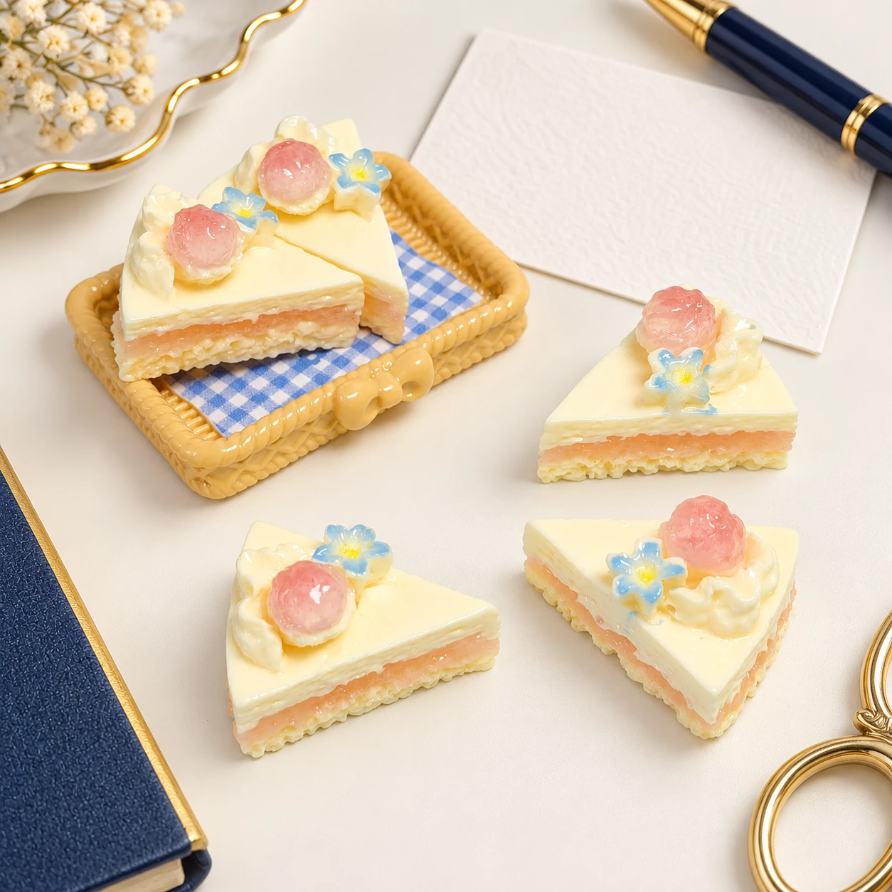 Fruit-Topped Triangle Cake Resin Charms RW002079 in an illustrative craft workspace