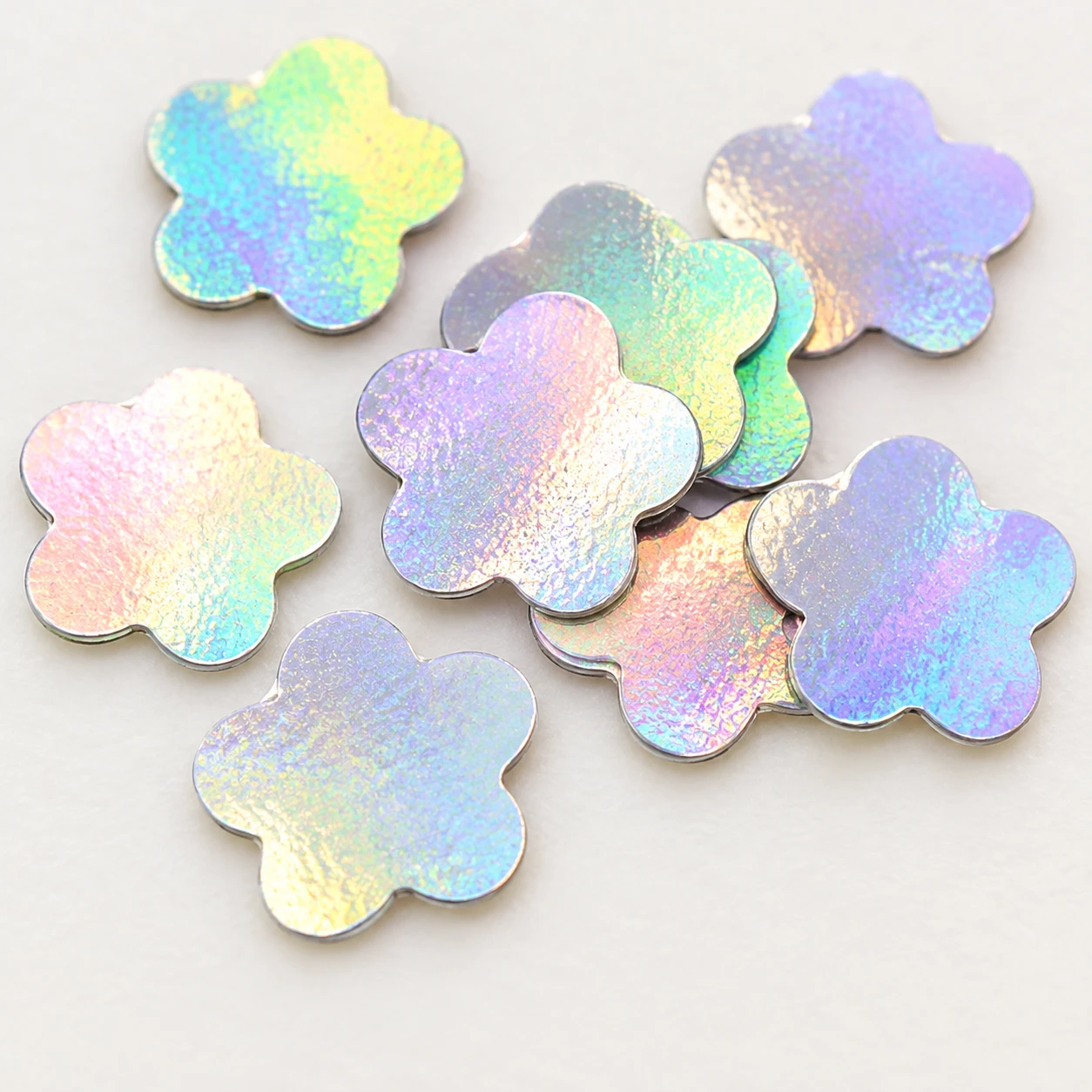 Iridescent Five-Petal Flower Sequins MA070 close-up showing the decorative shape and finish
