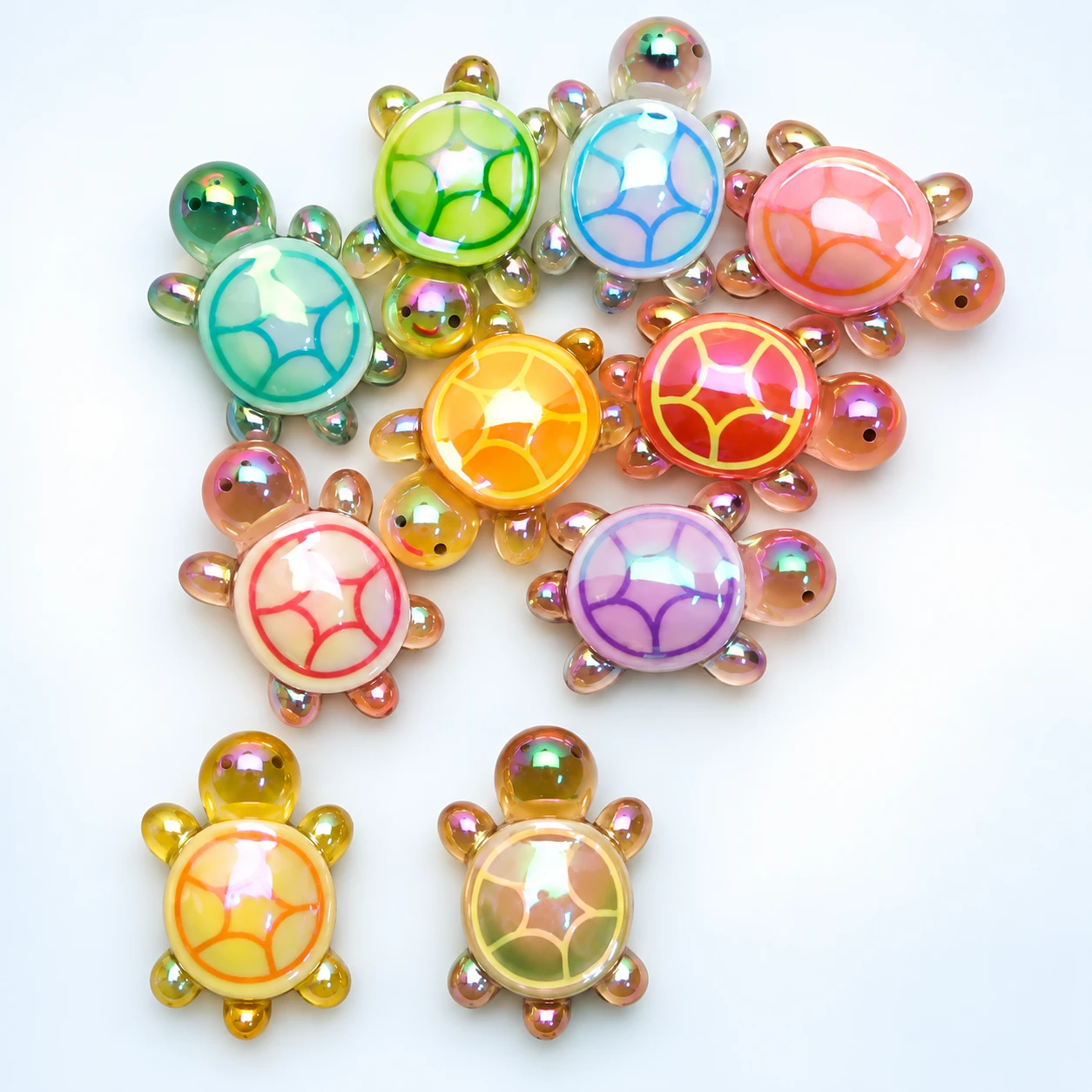Iridescent Mini Turtle Resin Charms RW0026057 on a clean light studio background
