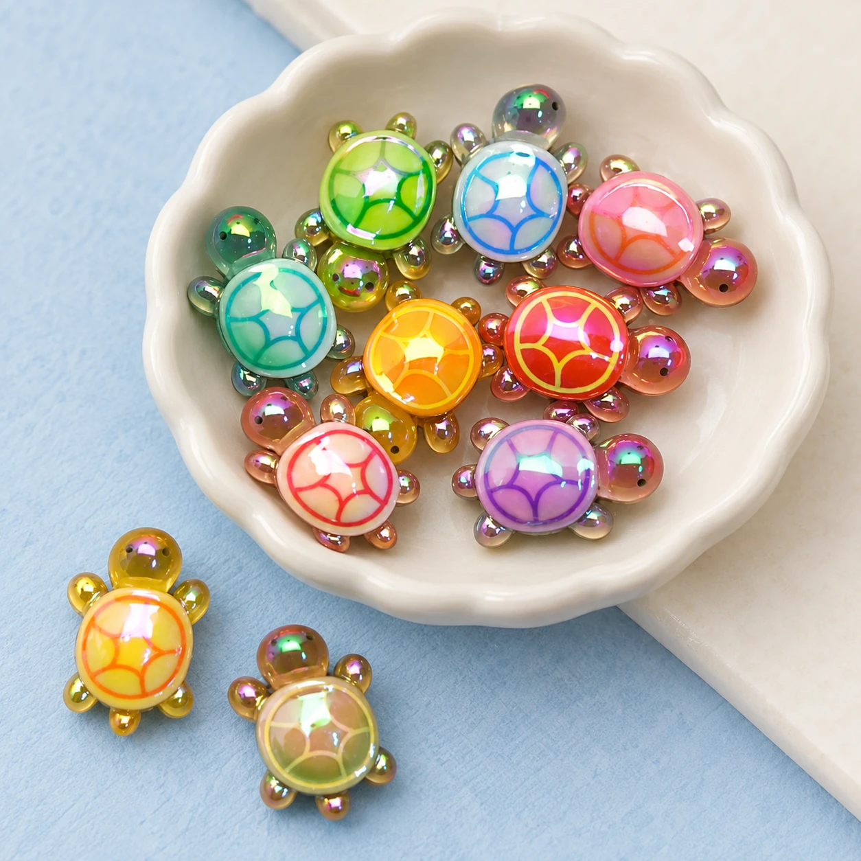 Iridescent Mini Turtle Resin Charms RW0026057 displayed for assortment selection