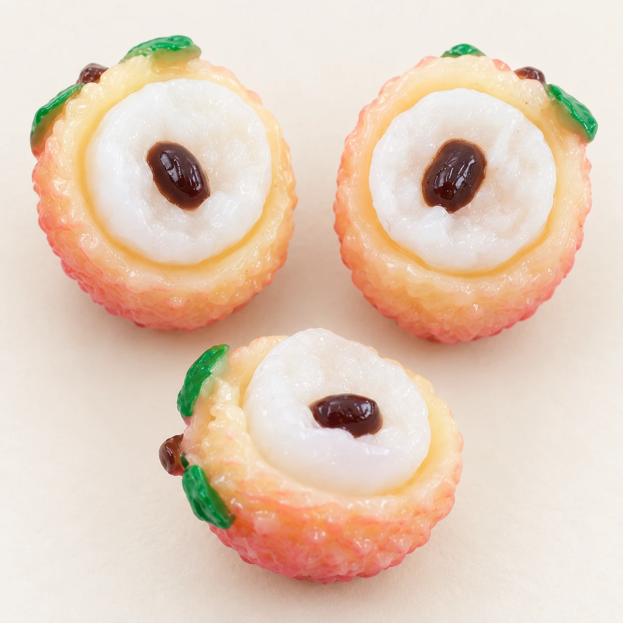 Lychee Half Resin Charms RW0022335 close-up showing the decorative shape and finish