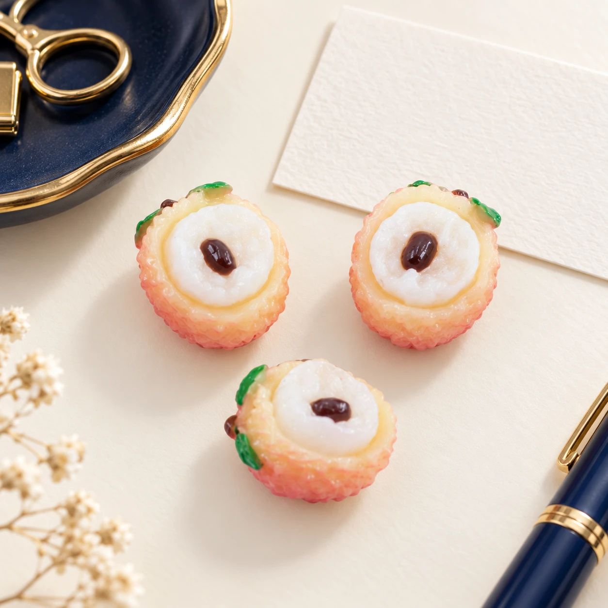 Lychee Half Resin Charms RW0022335 in an illustrative craft workspace