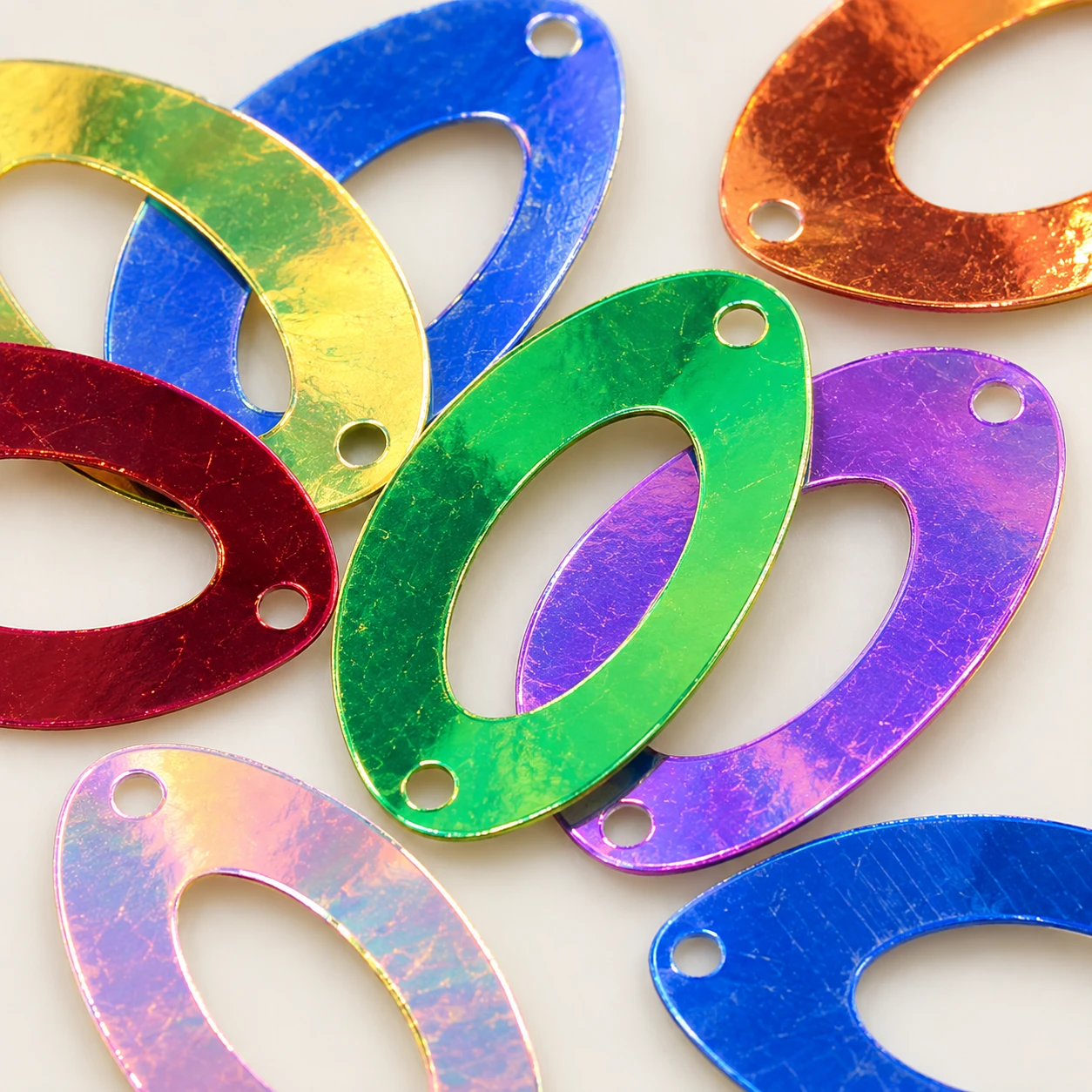 Metallic Hollow Oval Sequins MA052 close-up showing the decorative shape and finish