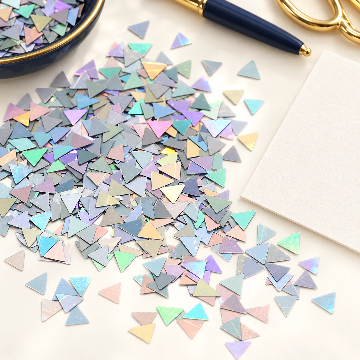 Mini Holographic Triangle Sequins MA105 in an illustrative craft workspace
