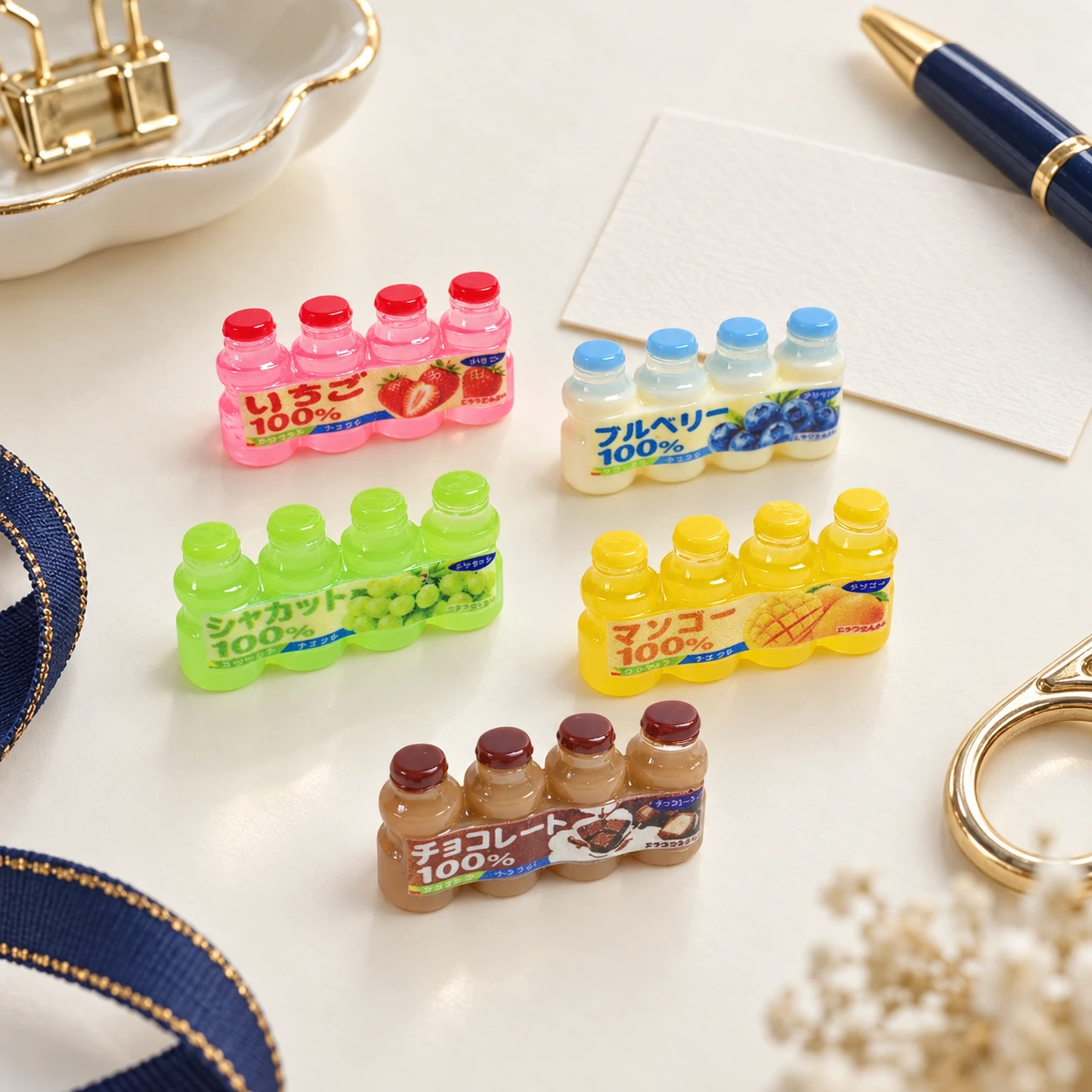 Mini Juice Drink Pack Resin Charms RW002074 in an illustrative craft workspace