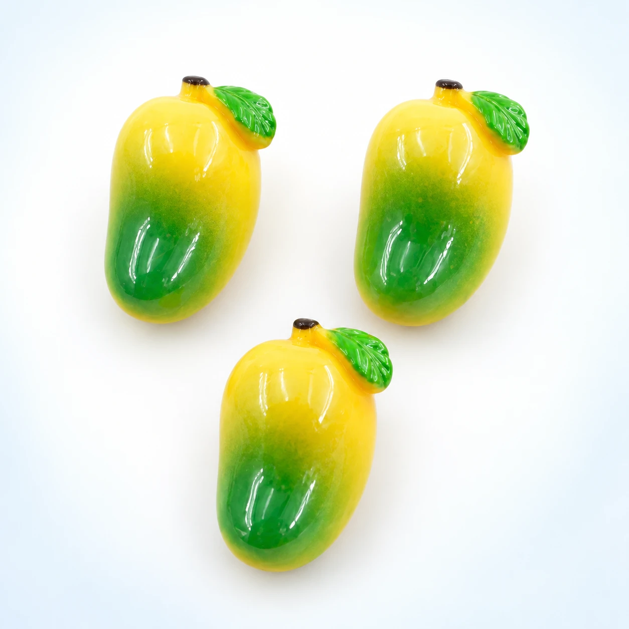 Mini Mango Resin Charms RW0023325 on a clean light studio background