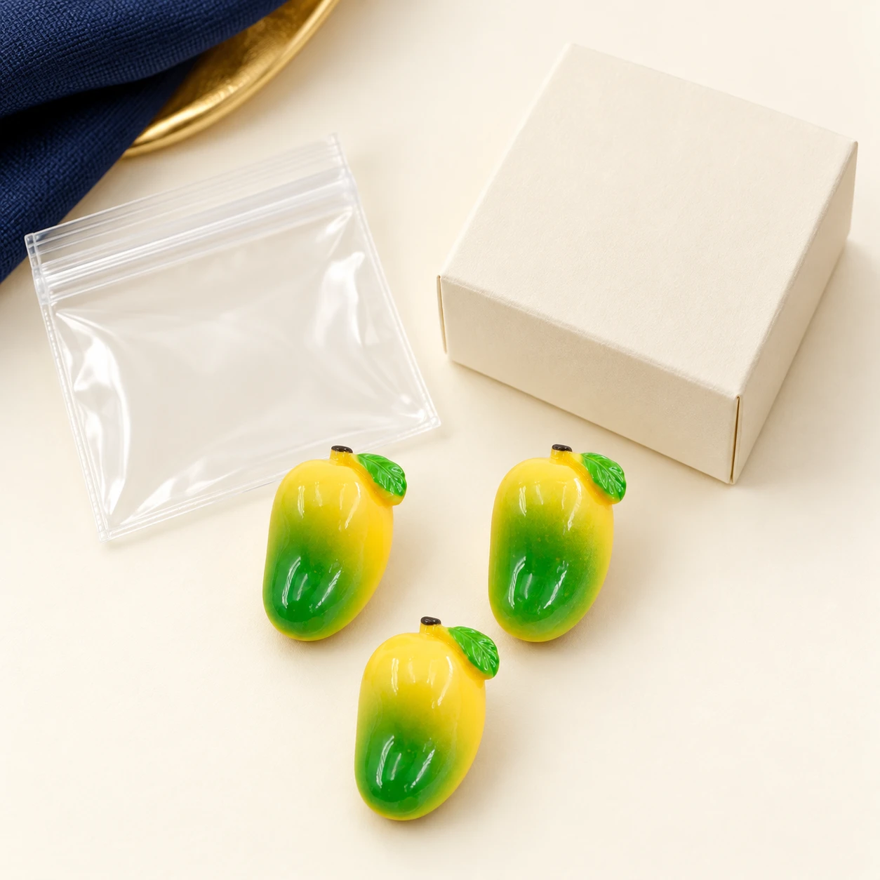 Mini Mango Resin Charms RW0023325 with illustrative private-label packaging