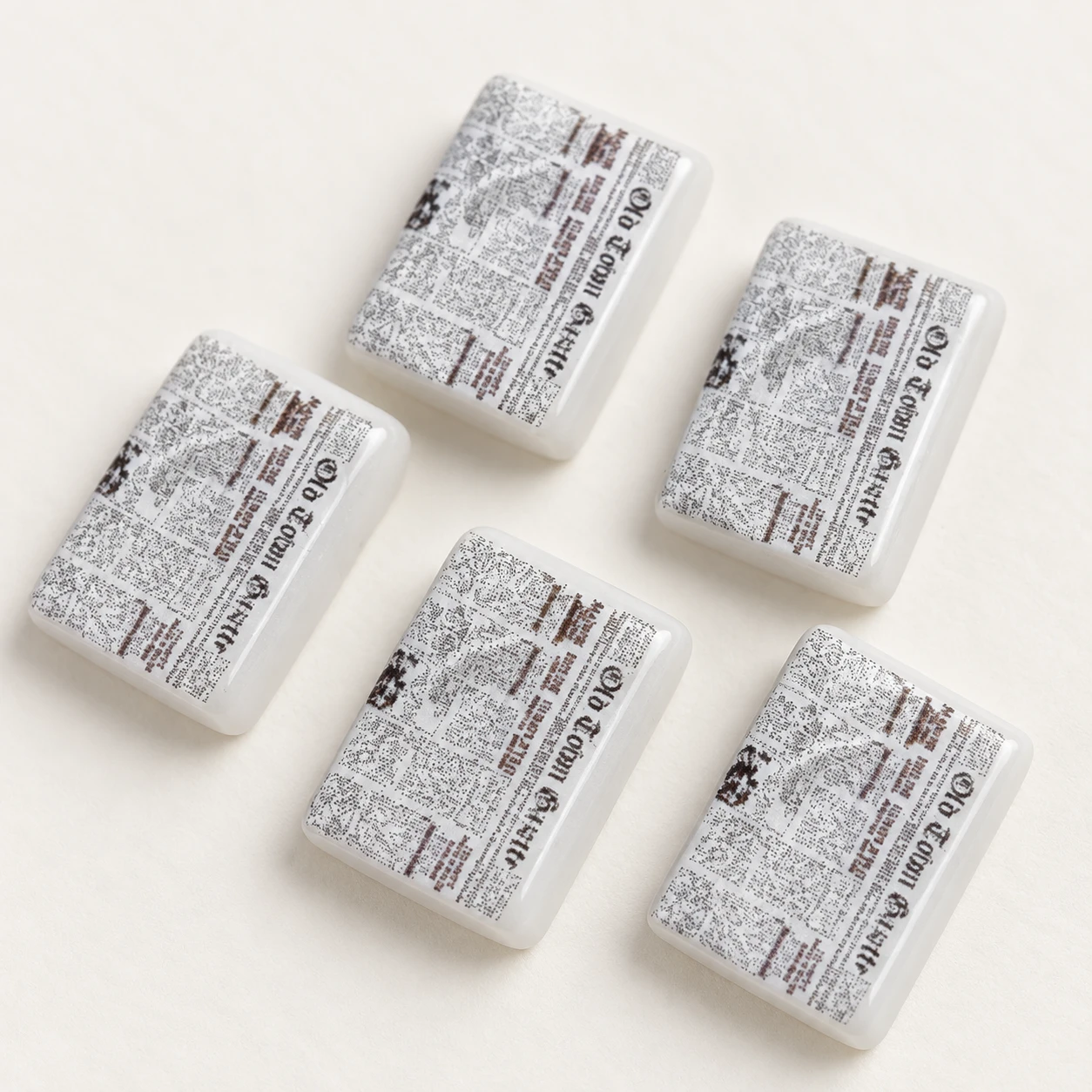 Mini Newspaper Resin Charms RW001857 close-up showing the decorative shape and finish