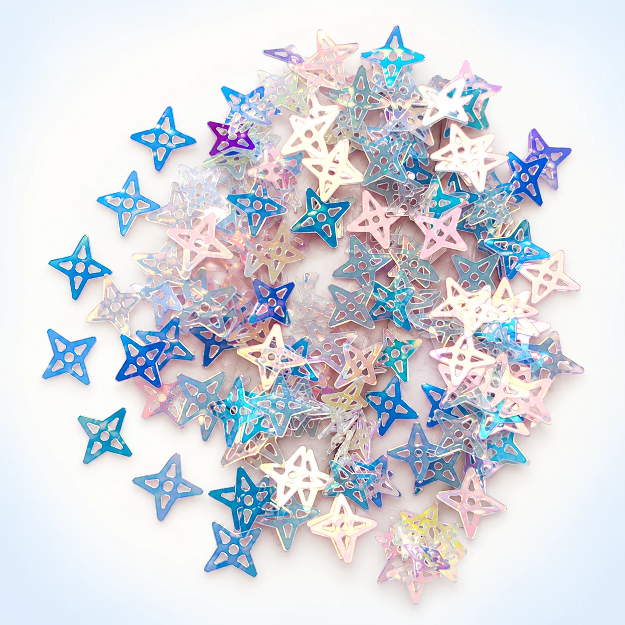 Openwork Holographic Star Sequins MA179 on a clean light studio background