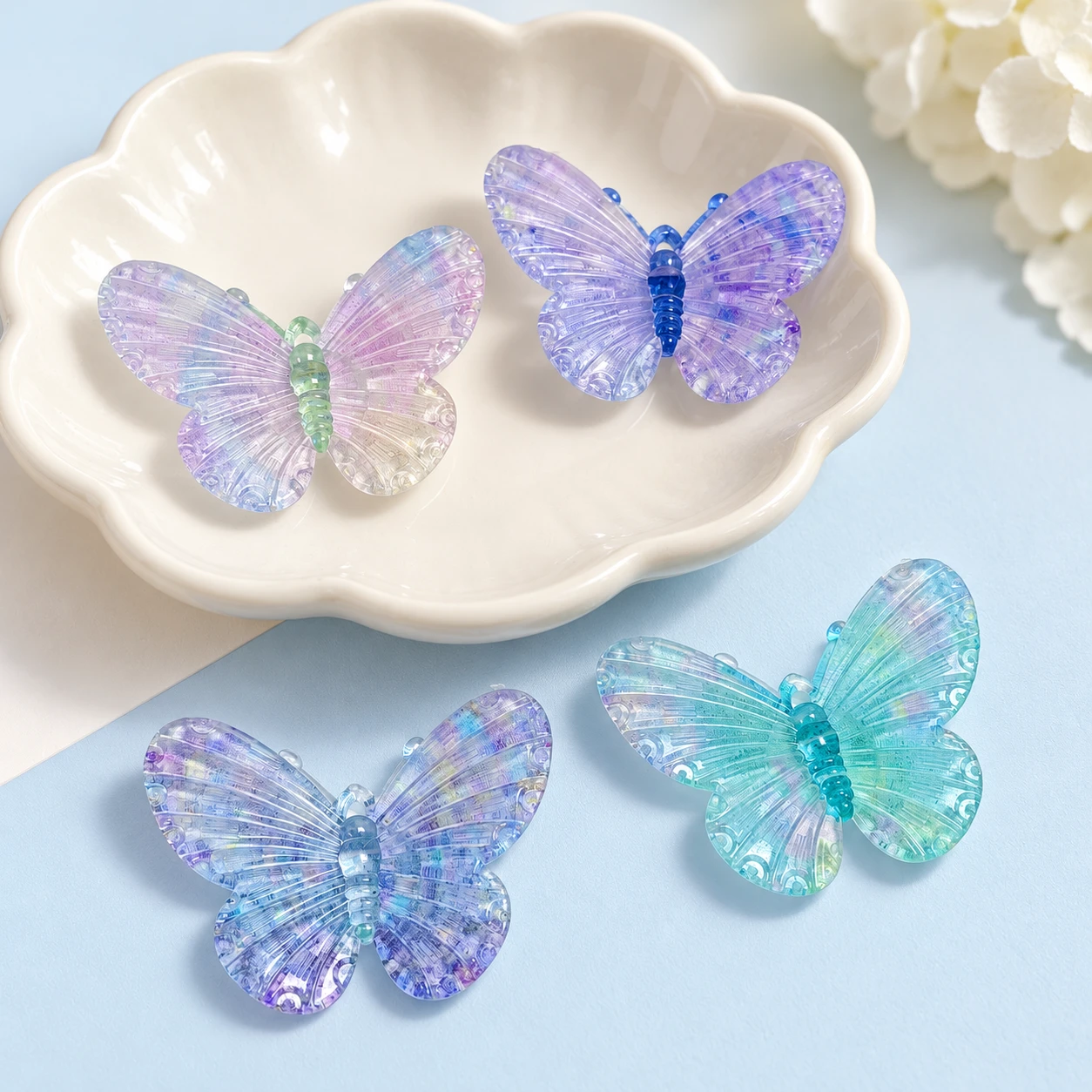 Pastel Iridescent Butterfly Resin Charms RW002654 / RW26619 displayed for assortment selection