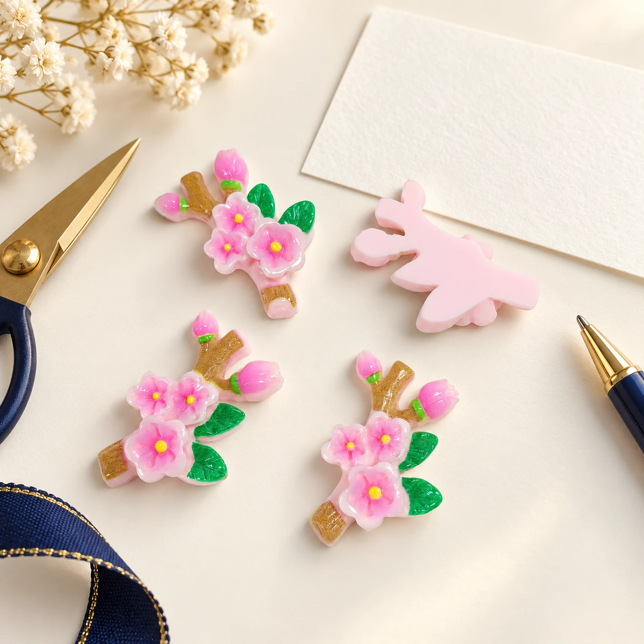 Pink Blossom Branch Resin Charms RW001862 in an illustrative craft workspace