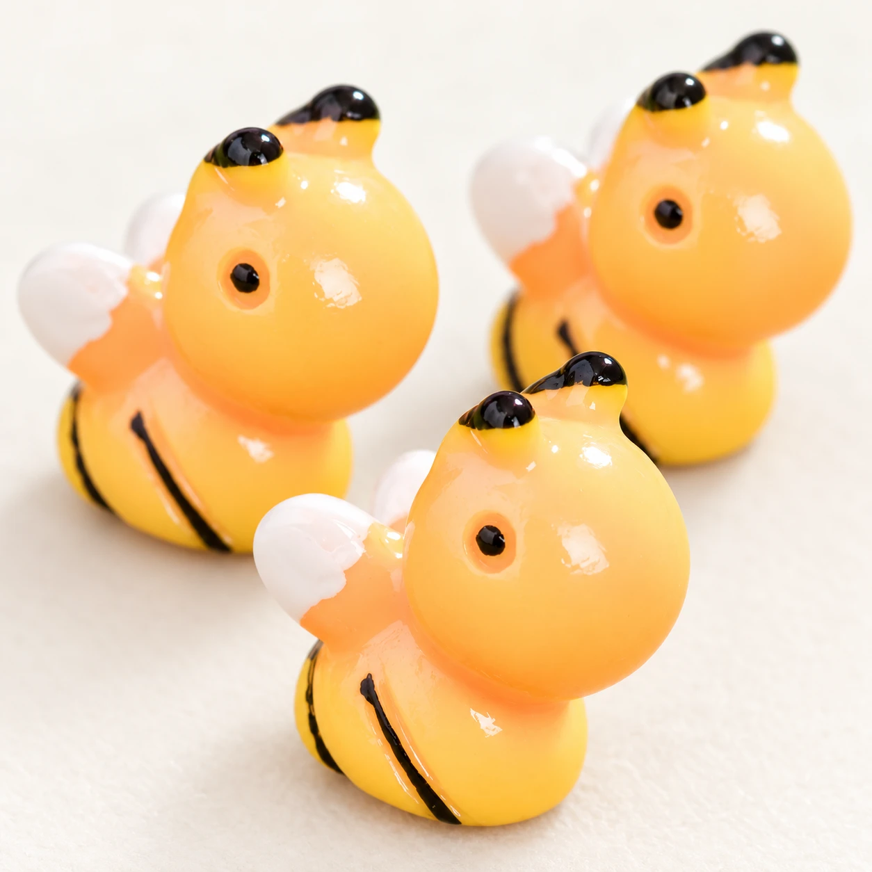 Rounded Bee Resin Charm RW002203 close-up showing the decorative shape and finish