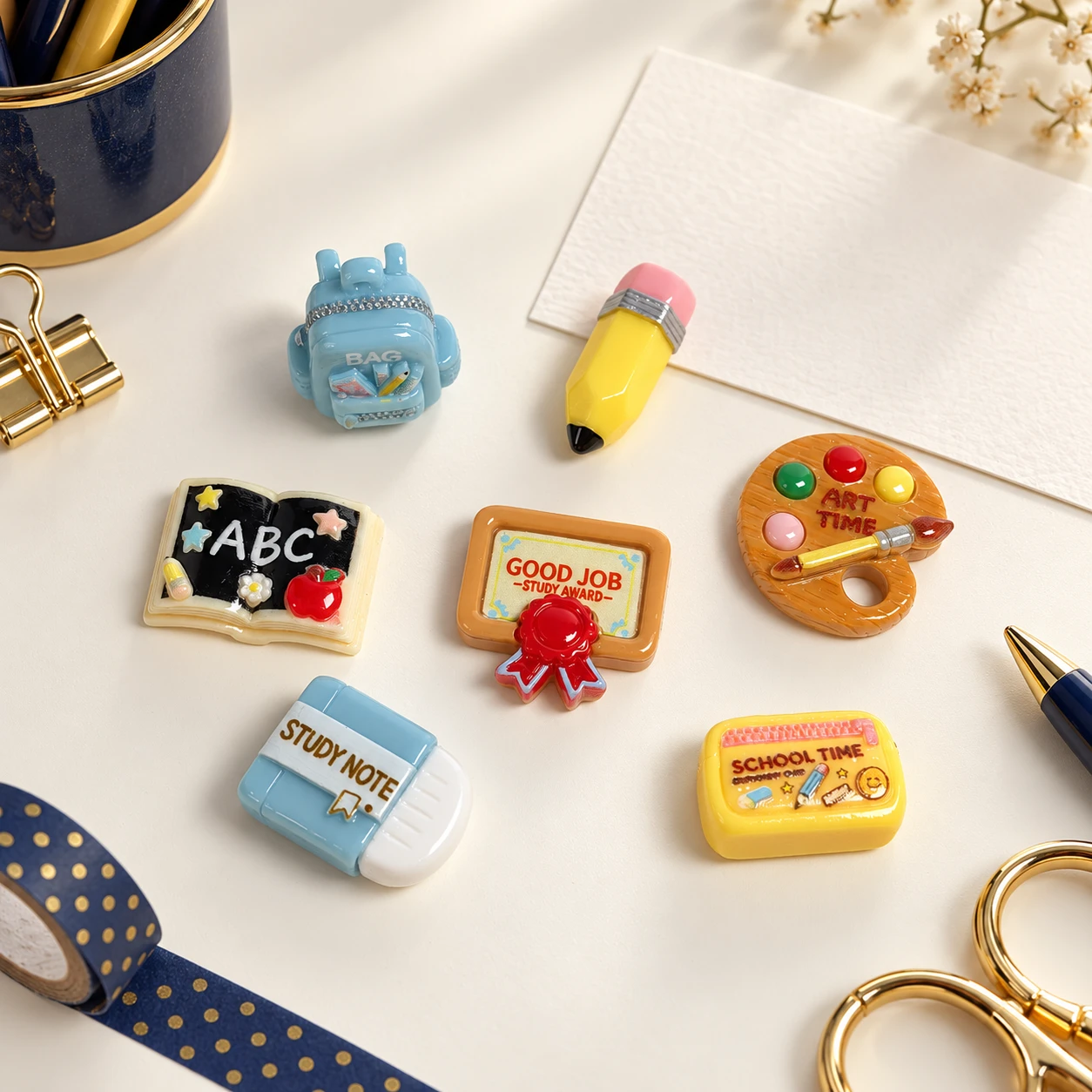 School Stationery Resin Charms RW003559 in an illustrative craft workspace