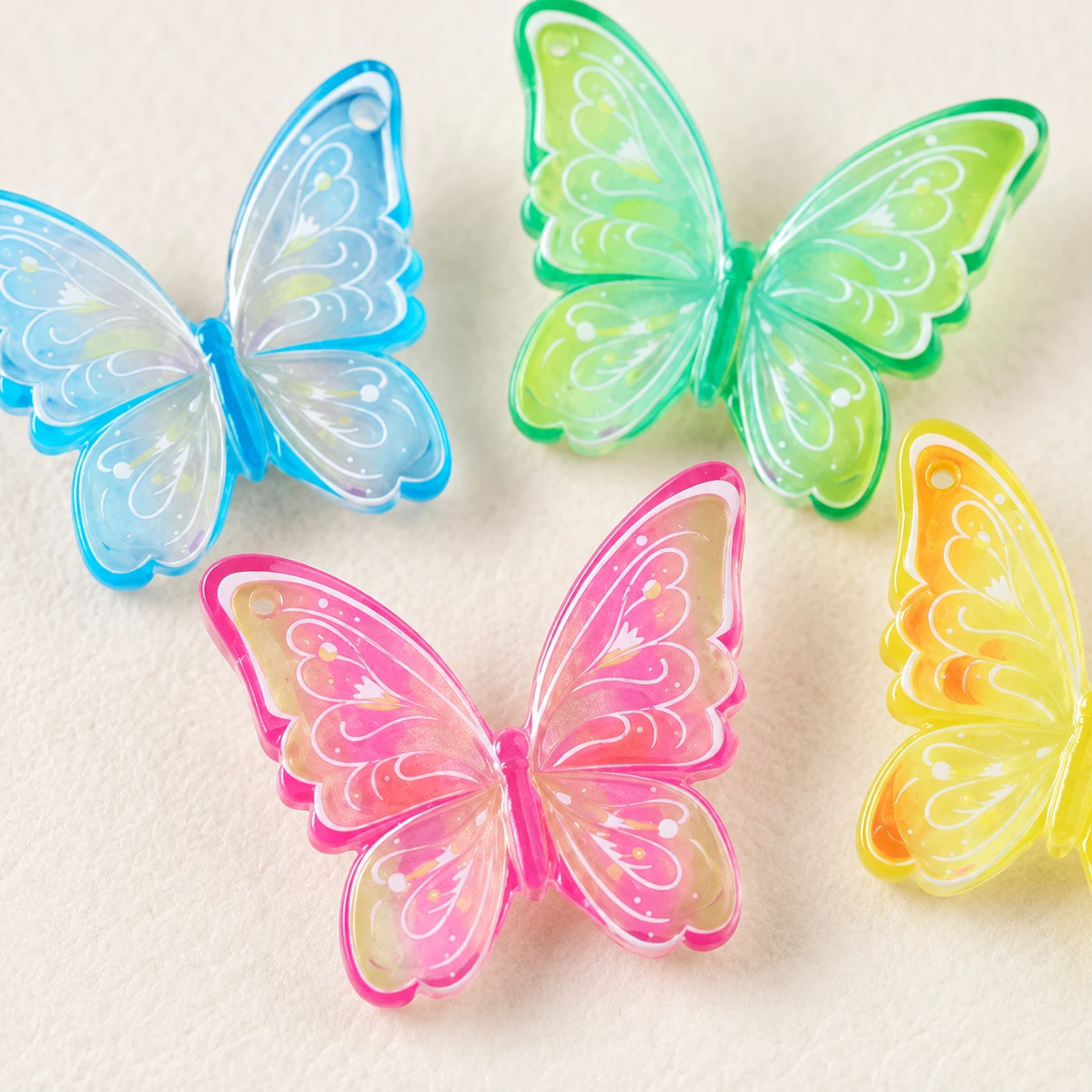 Translucent Butterfly Resin Charms RW003309 close-up showing the decorative shape and finish