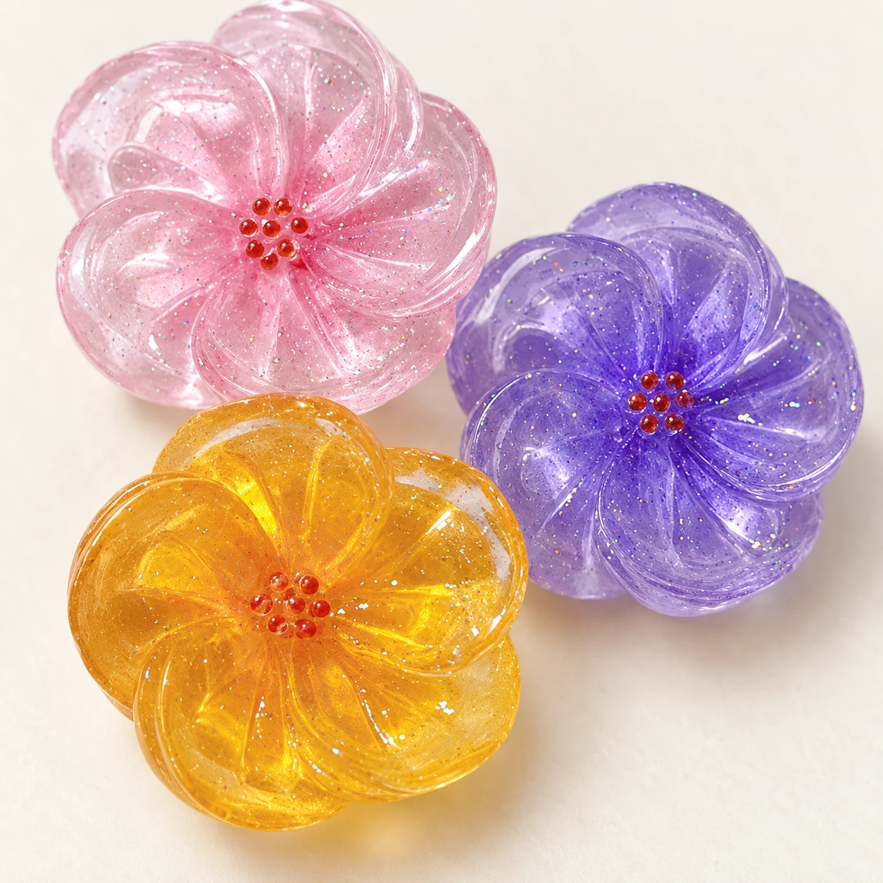 Translucent Glitter Flower Resin Charms RW0022500 close-up showing the decorative shape and finish