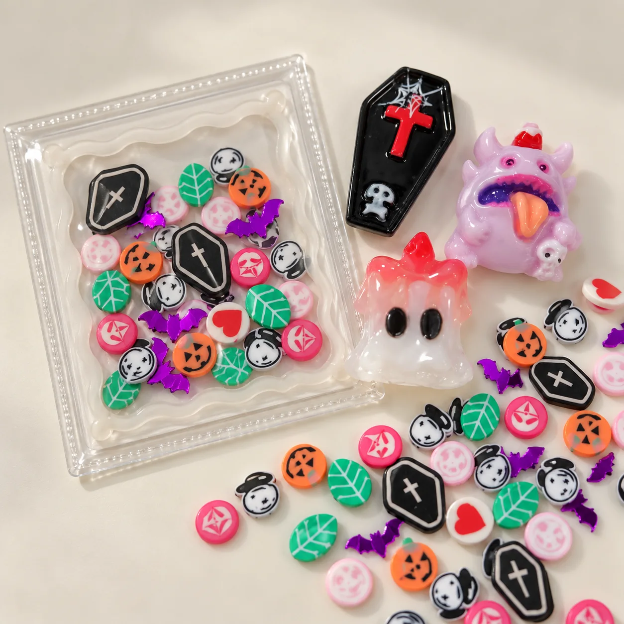 Illustrative dry shaker filled with small Halloween slices beside resin coffin ghost and monster charms