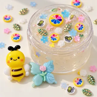 Illustrative slime jar with small bee, rainbow and flower pieces; large bee and blue flower charms beside it