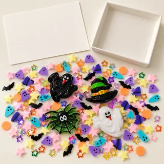 Illustrative blank craft card and loose ghost, witch hat, spider and pastel filler pieces