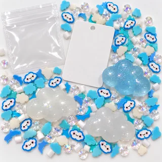 Illustrative blank craft card and empty pouch beside loose blue and white cloud filler pieces