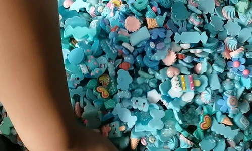 Blue and turquoise decorative charms collected together for assortment sorting