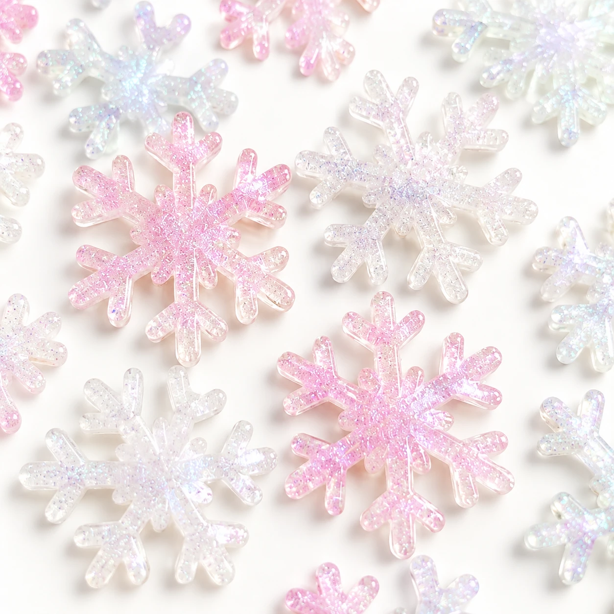 Detail visualization of iridescent snowflake resin charms, RW24359